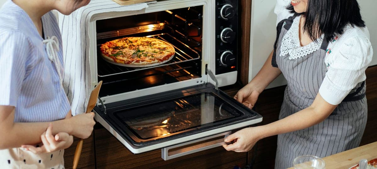 An electric pizza oven on a kitchen counter