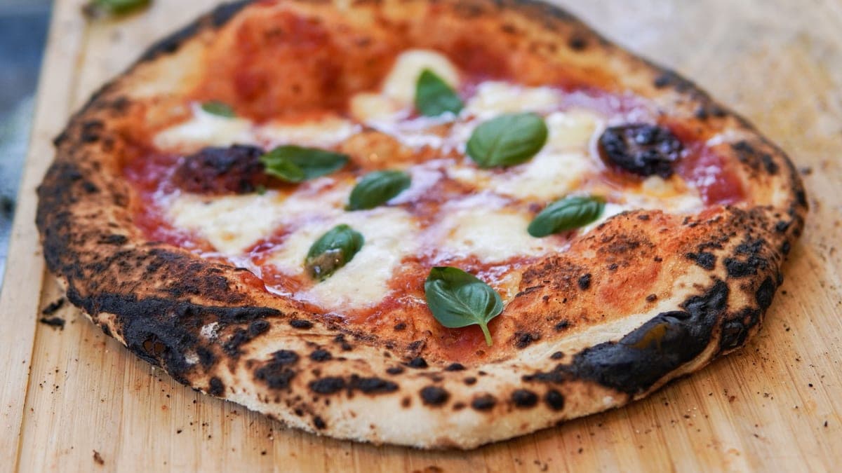 A margherita pizza with a blistered crust